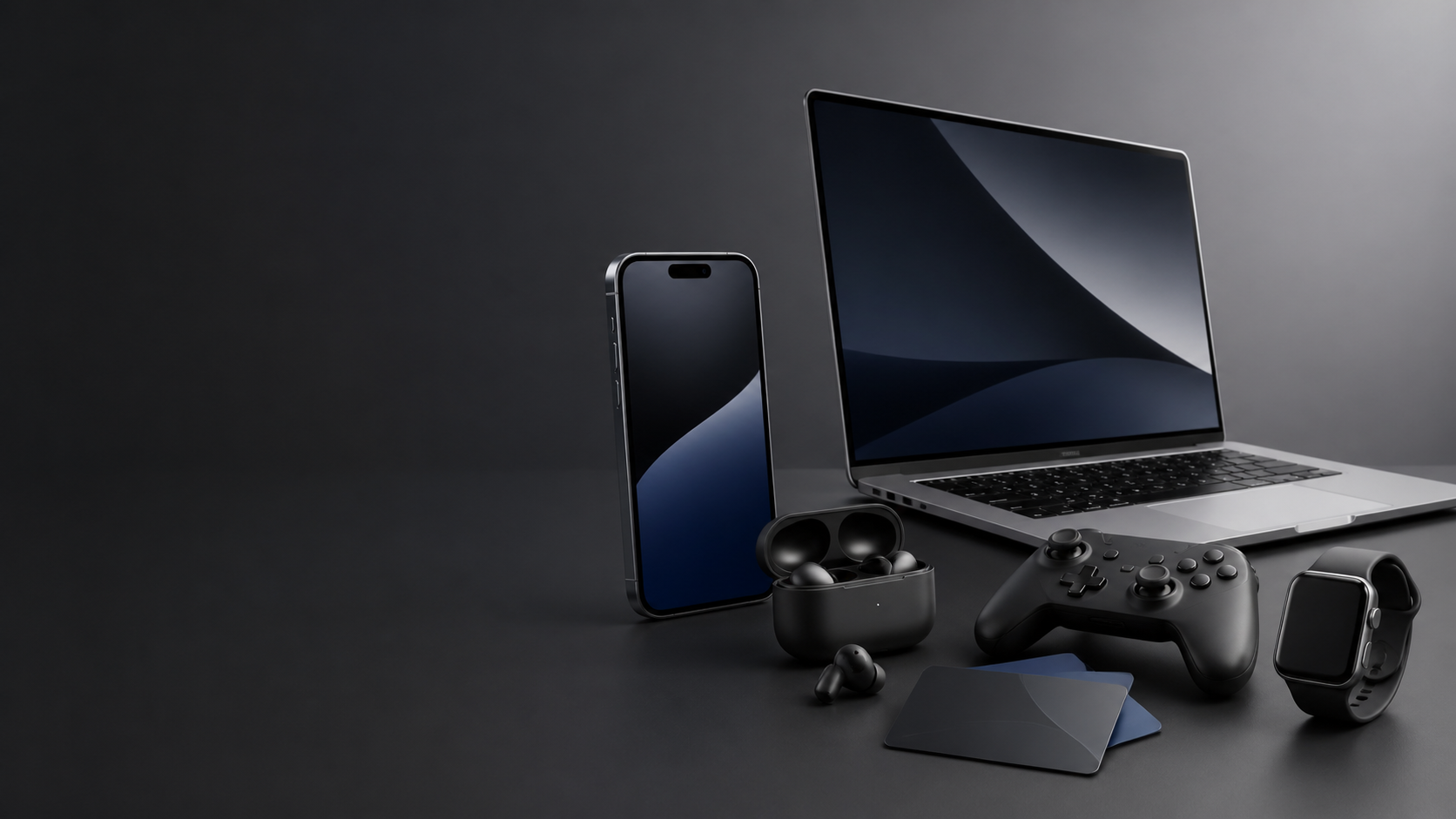 A premium arrangement of generic everyday technology including a phone, laptop, headphones, smartwatch, controller, and blank gift cards.